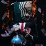 A man in a suit holding the world in a bag with one hand, a wad of cash in the other hand, and a starbucks bag over his head.