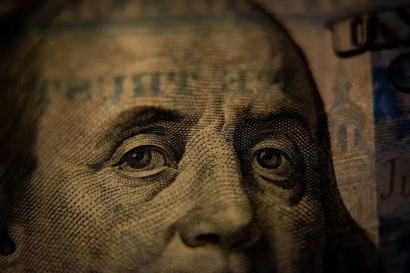 a close up of benjamin franklin on a 100 dollar bill - capitalism