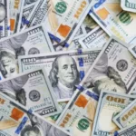 A pill of $100 bills - capitalism - foreign direct investment