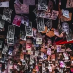 A variety of currencies pinned on a ceiling as decoration - symbolic capital