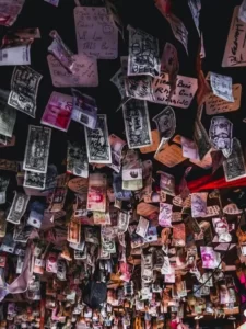 A variety of currencies pinned on a ceiling as decoration - symbolic capital