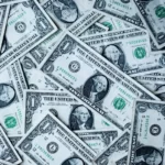 A pile of US dollar bills - capitalism