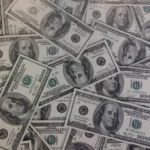 A montage of dollar bills