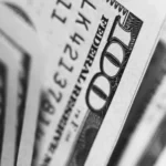 black and white close up of a 100 dollar bill