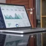 A graph on a laptop screen showing causes of inflation