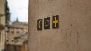 a set of various religious symbol on a wall