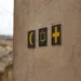 a set of various religious symbol on a wall