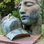 An iron statue of two faces objectified