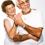 An older age couple looking smug