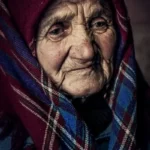 An older woman wearing a shawl