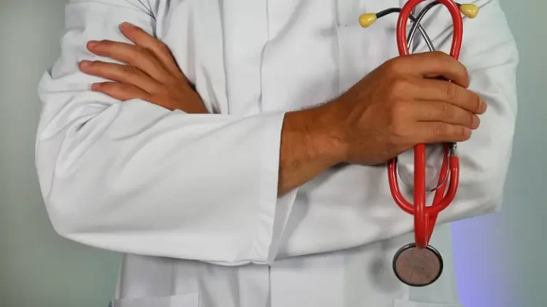 The Impact of Neoliberalism on the nhs - A doctor holding a stethoscope - health disparities