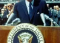 John F Kennedy giving a speech at a lectern democracy