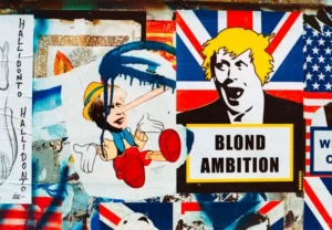 An art piece depicting idiot boris johnson with the statement 'blond ambition' - politics