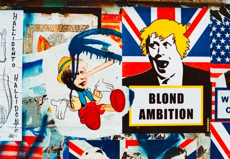 An art piece depicting idiot boris johnson with the statement 'blond ambition' - politics