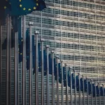 A curved line of european union flags