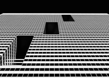 black and white shot of an unidentifiable postmodernity building structure