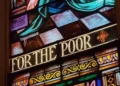 A stained glass window saying 'for the poor