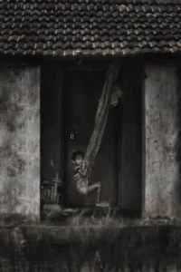 A child on a cloth swing in black and white