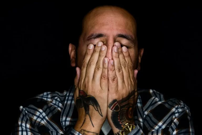 a person with thier hands over their eyes - stigma