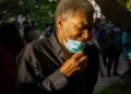 A black man with a medical mask