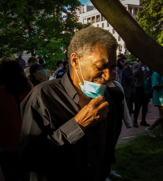 A black man with a medical mask