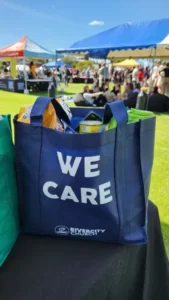 A shopping bag in blue with the words 'we care' - altruism