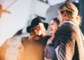 three women laughing and talking outside social constructionism