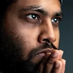 A man looking thoughtful about consciousness
