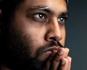 A man looking thoughtful about consciousness