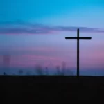 A giant cross outside after sunset