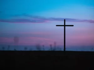 A giant cross outside after sunset
