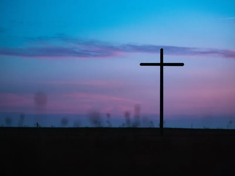 A giant cross outside after sunset