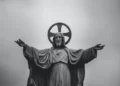 A black and white statue of jesus christ