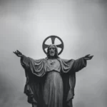 A black and white statue of jesus christ