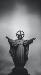 A black and white statue of jesus christ