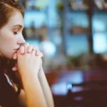 A young lady praying
