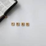 scrabble tiles displaying the word 'pray'