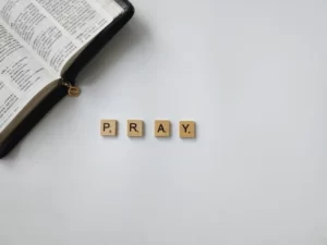 scrabble tiles displaying the word 'pray'