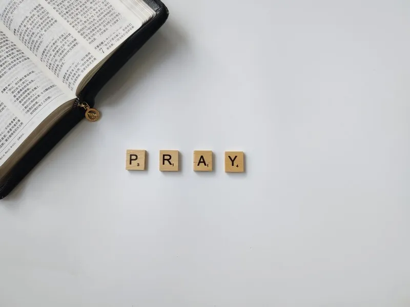 scrabble tiles displaying the word 'pray'