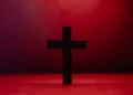 a christian religion cross against a red background