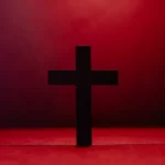 a christian religion cross against a red background