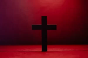 a christian religion cross against a red background