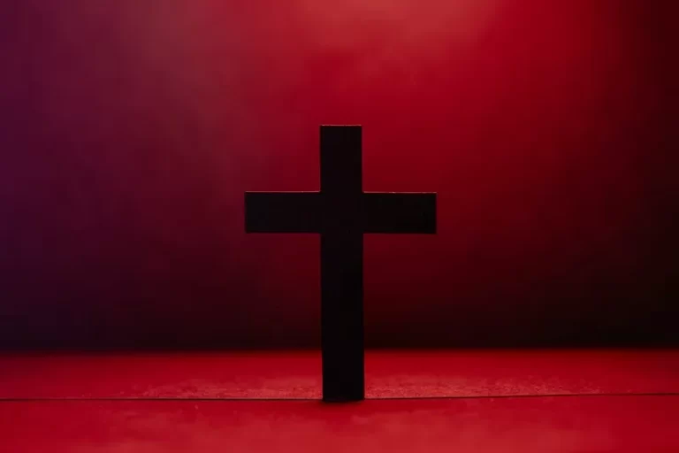 a christian religion cross against a red background