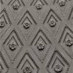 A wall decorated with diamond shapes containing flowers - reproduced, habitus, habitual
