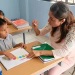 A school social worker talking to a young boy