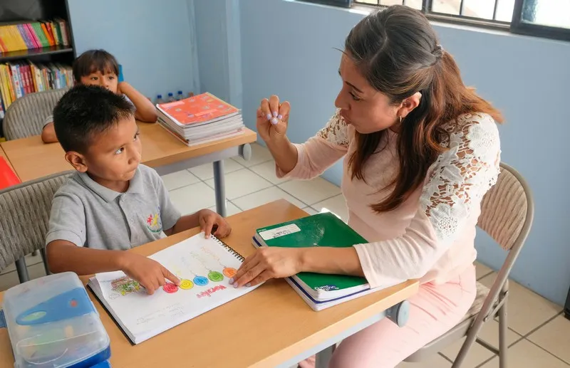 A school social worker talking to a young boy