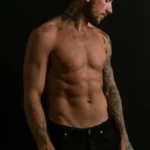 A male model with no shirt on - sexualisation