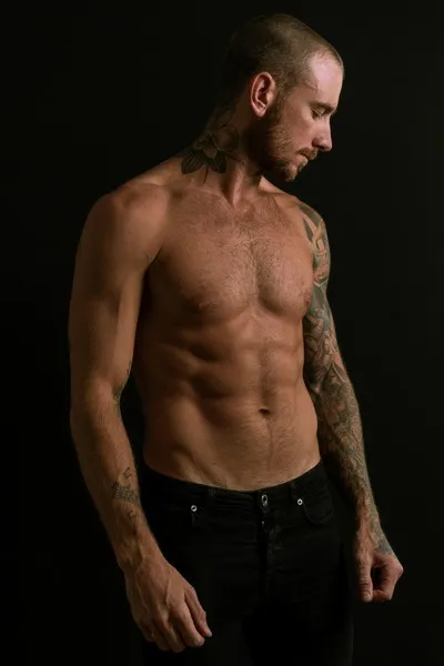 A male model with no shirt on - sexualisation