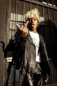 a black punk giving the middle finger - school counter culture