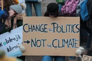 Protest placard reading 'change politics not the climate'